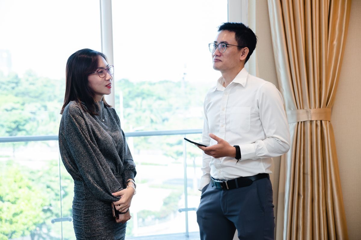 Two colleagues reviewing work together